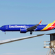 A Southwest Airlines Boeing 737 Max aircraft landing at the Southern California Logistics Airport in Victorville, California, where the airline is storing its 737 Max jets until they are again cleared to fly passengers, on March 23, 2019.
